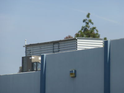 So-so Camo'ed Pop-Up Site in Los Angeles (San Fernando Valley)
This is a so-so camo rooftop site in the San Fernando Valley portion of Los Angeles.  It uses open-back pop-ups on the building to mostly hide the antennas.
Keywords: Pop Up pop-up Los Angeles San Fernando Valley roof top rooftop
