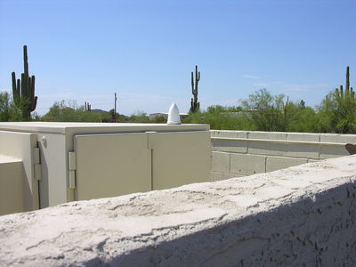 GPS Antenna Directly Mounted to Cabinet
This is a good example of how a GPS antenna can use directly mounted on top of an equipment cabinet.  This type of mounting reduces the visibility of this element compared with mounting it on an extension pipe above the cabinet.  This is a Verizon Wireless site at a church in Mesa, Arizona.
Keywords: mesa arizona verizon gps antenna church