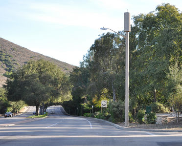 AT&T Camo Light Standard
AT&T's camo light standard site at Cresthaven and Westlake Blvd. in Thousand Oaks, California.  The antennas are within the radome above the light arm.  The GPS antenna above the radome should not be visible based on the plans approved by the Planning Commission.
Keywords: AT&T,light,standard,thousand oaks,cresthaven,radome,gps,
