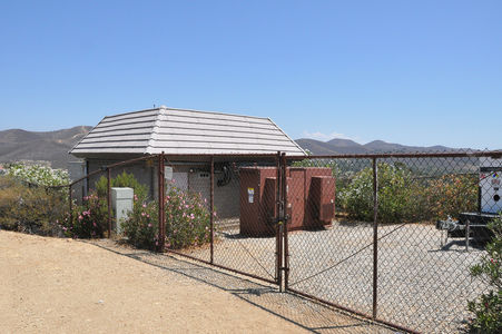 Would Verizon please let the Sprint Nextel inside?
The inside of the building is occupied by Verizon.  Verizon's antennas are behind the faux tiles.  Sprint's Nextel cabinets are outdoors adjacent to the building, and its antennas are on H-Frame mounts (see the associated pictures).
Keywords: Verizon Sprint Nextel thousand oaks