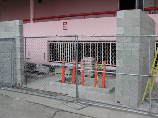 3. Base Telecommunications Station Equipment
This new addition to the existing structure at the rear of the building is to house the BTS equipment, plus a future standby power generator, power switching equipment, and a telephone interface panel.  The standby power generator pad is the the one nearest the fence.  The BTS equpipment pad is to the rear-left in this photo.  Later, things will change a bit...oops!
Keywords: verizon armacost