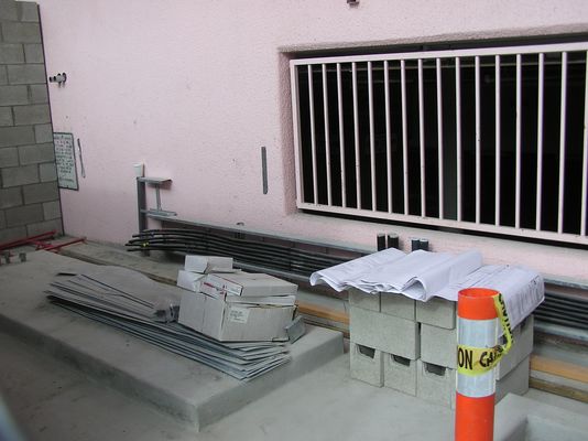 4. BTS Pad and Cable Termination
The raised concrete pad is to support the BTS equipment.  The cables that dead-end in the wall-mounted tray will connect the roof antennas to the BTS.
Keywords: verizon armacost