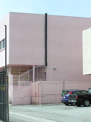 11. Cables are now in the Cable Tray
We're getting closer!  Notice that the cables make a gentle (less than 90 degree) bend at the bottom of the ladder where it connects to the tray in the hallway.  Bending cables too much can kink them.  Kinking can cause excessive signal transmission losses.  Not a good thing!    Also notice that the GPS antenna is now installed--quite visibly--at the top of the cable tray on the roof.  More in the next photograph...
Keywords: verizon armacost