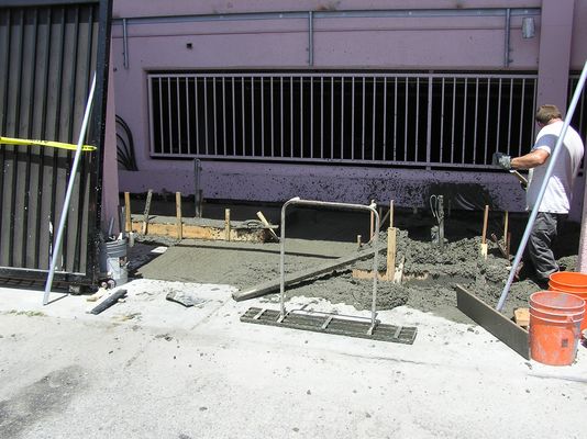 25. It's Raining, It's Pouring (Concrete)
Here's the new re-poured pad.  It's just been poured.  There'll be a cure period to let it harden before moving the equipment into the area.
Keywords: verizon armacost