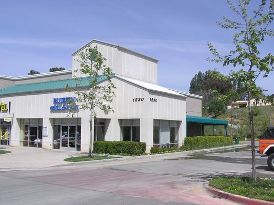 Camo, almost matching... (1 of 2)
This Cingular site is a good example of the need to carefully plan how much of an existing wall will be replaced with a fiberglass camo panel.  In this case, the cut out portion of the wall, now replaced with a painted/textured RF transparent panel, is clearly visible.  A better approach would have been for the carrier to cut from wood panel edge to panel edge so that the difference, if visible, would have been more uniform.
Keywords: cingular simi valley camo panel