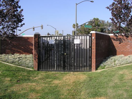 BTS Equipment Behind Monument Sign
At California Lutheran University in Thousand Oaks, California.  The antennas are in the radome atop the parking lot lights (not seen in this photo), and the BTS equipment is in the background behind the monument entry sign.

Keywords: California Lutheran University thousand oaks camo light standard parking cingular