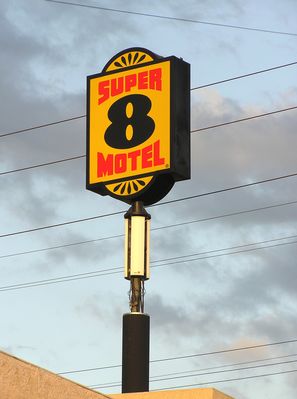 Super Signal From Super 8
Cingular built this camo site below a sign at the Super 8 Motel in Azusa, California.  For some reason the radome cover is missing, exposing the three sector antennas to public view.
Keywords: Cingular Azusa Super 8 Motel Sign