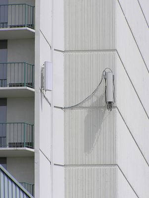 Multi-carrier Cell Site Cleverly Disguised As An Upscale Hotel
Looking northeast.  Close-up of cells on the  southwest wall.  Notice the loose cables.
Keywords: multicarrier torrance hotel hilton