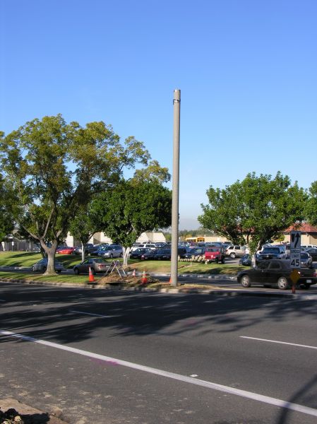 Light Standard Under Construction
The double arms of this light standard, and the radome containing the antennas above the arms are yet to be placed.  The light standard is located in the greenbelt median of the roadway.
Keywords: Verizon CEV installation Irvine light standard double arm radome