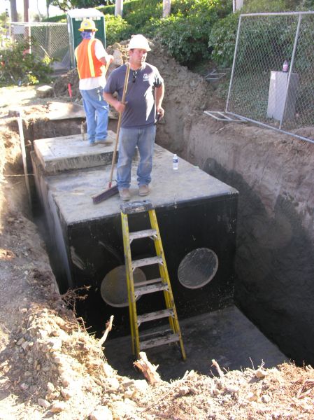Not part of an underground water river...
The water bottle is not part of the CEV. 
Keywords: Verizon CEV installation Irvine light standard double arm radome