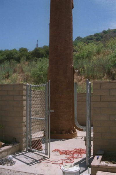 Tree Trunk Firmly Planted!
This photo shows the detail of the monopalm trunk installation to the foundation.  Footings are sunk and concrete is poured around the footings.  The tree is bolted to the footings.
Keywords: monopalm sepulveda mullholland los angeles trunk tree concrete poured footings bolted