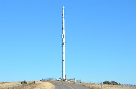 A Terrible Missile Rises Over the New Mexico Horizon
This is a monster of a visible site. It stands 150 feet tall and is located on the I25 Frontage Road east of County Road 57 south of Santa Fe, NM. There is another photo in this gallery showing just how awful this site is from afar.
Keywords: Alltel,santa fe,monopole