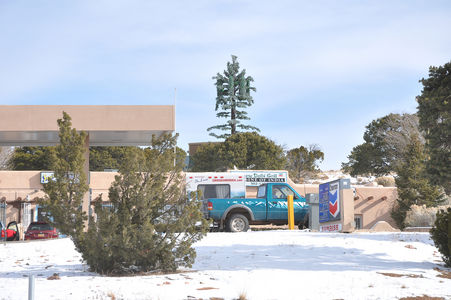 Sickly Monopine
Off of the Old Las Vegas Highway outside of Santa Fe, this poorly designed monopine stands out like the sore thumb it is.  The branch coverage, branch count, and panel antenna socks are inferior.  A properly designed and executed monopine would not all the antenna stand-off arms to be seen, much less be painted a highly visible green.

By the way, in this case, Las Vegas refers to Las Vegas, New Mexico, rather than to Lost Wages, Nevada.
Keywords: monpine,santa fe,new mexico,nm,las vegas,socks,branch,count