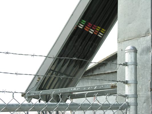 The Sweet Taste of Signal
A view of the jumper-to-hardline and grounding point for this unidentified carrier at the old Loveland Sugar Co. silo.  The colored tape is used to identify the antenna sectors and whether the antennas are transmit or receive.  Loveland, Colorado.
Keywords: cingular grain silo loveland colorado sugar