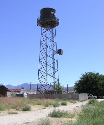 Drunk Tank?
This series of photos of an interesting Verizon faux water tank in Littlerock, California suggests that perhaps something was amiss when the tank was installed on the legs, don't you know!  The microwave dish is for 'back haul' to the MTSO.
Keywords: littlerock california verizon faux water tank drunk