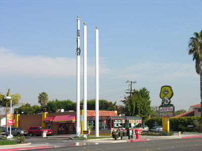 Buns, please!
T-Mobile's flagpole site, standing adjacent to another carrier's flagpoles, awaits the installation of the panels once the antennas are wired and optimized.
Keywords: t-mobile mcdonalds huntington beach antenna panels flagpole site