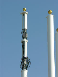 No Buns!
T-Mobile's flagpole site at a McDonald's in Huntington Beach, California is not yet complete.  This closeup shows the antenna, the tower-mounted-amplifiers, the remote tilt activators, and all the other fun stuff that makes this site play.
Keywords: t-mobile mcdonalds huntington beach antenna panels flagpole site