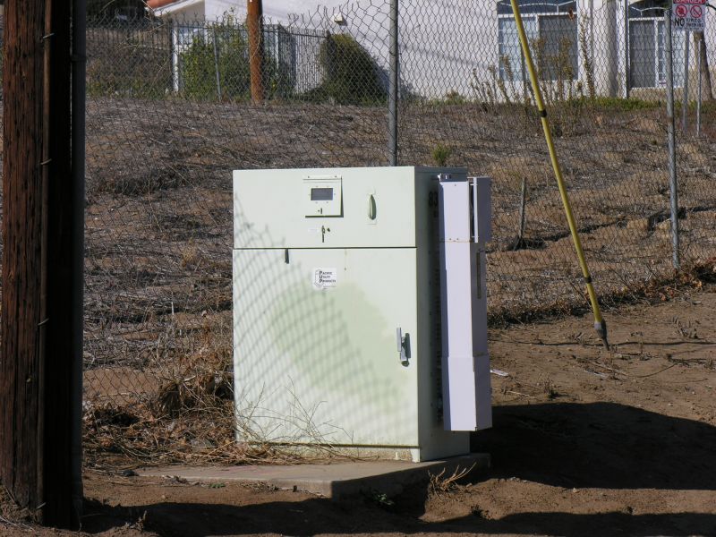 Das da ticket!
AT&T uses a distributed antenna system (DAS) to light this site on Valley Circle in the San Fernando Valley (Los Angeles County).  The DAS node, manufactured by Andrew Corporation, is the small box affixed to the larger power meter pedestal cabinet.
Keywords: das distributed antenna system node andrew corporation power meter pedestal cabinet
