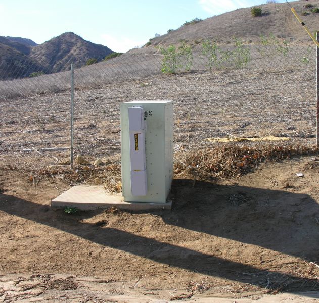 Das da ticket!
AT&T uses a distributed antenna system (DAS) to light this site on Valley Circle in the San Fernando Valley (Los Angeles County).  The DAS node, manufactured by Andrew Corporation, is the small box affixed to the larger power meter pedestal cabinet.
Keywords: das distributed antenna system node andrew corporation power meter pedestal cabinet