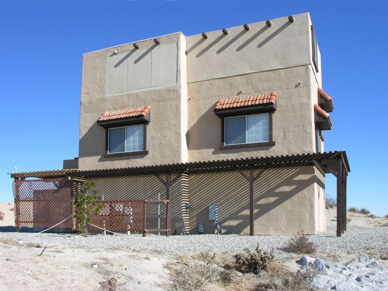 Wireless Adobe
Looking at the west and south sides of Cingular's wireless adobe site. It's on a bluff above California Highway 62 southeast of Yucca Valley, California. It appears to be 'just another house on a hill' until you get up close and personal. The site is owned by InterConnect Towers LLC (FCC ASR 1050520).
Keywords: cingular yucca valley california adobe interconnect towers llc
