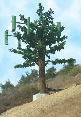 08 - Faux Branches Installed
Our little tree is taking shape now the branches have been installed.  Notice the unprotected coaxial cables running to the tree near the base (right side).
