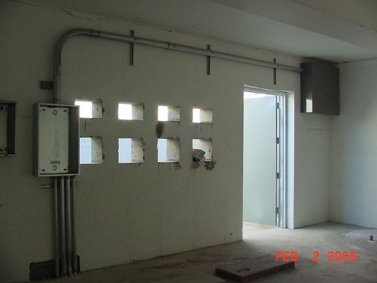Inside the Transmitter Vault
Looking northwest, this photo shows the air conditioning ports and the entry door.
Keywords: kmlt equipment air conditioning door Bill Cloutier