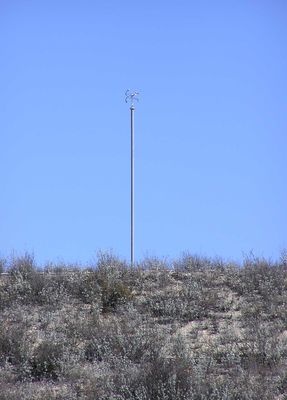 Looking at the antenna of an FM broadcast station
Here's a photograph of KMLT-FM's antenna and supporting post from a vantage point near the location.  
Keywords: KMLT-FM