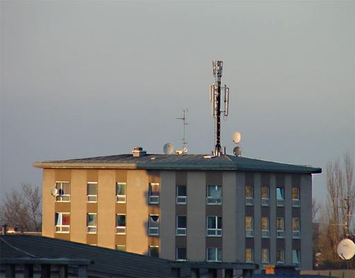 Salzburg, Austria cell site - Apartment Building
This is a cell site on the roof of an apartment building in Salzburg, Austria.  I snapped this photo from my hotel room after having just lectured on cell siting at the Center for International Legal Studies.
Keywords: salzburg austria