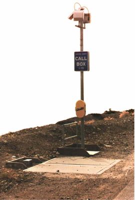 Cell Call Box
Where there's nothing else vertical, some carriers will build cell sites on call boxes.  This call box (now replaced) was installed on the Pacific Coast Highway near Point Mugu, California.  The base station equipment was located in the flush vault in the foreground.
Keywords: Call Box