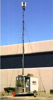 COW: "Cell on Wheels"
COWs are used to provide temporary service, usually to special events, before the installation of a cell site, or in emergencies.  Here's a COW owned by Nextel that was used to provide temporary service was the permanent site was being constructed on the roof of the building.
Keywords: Moooo.  Cow.