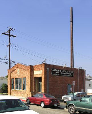 Signal from a dead tree
This wood pole supports a cell site radome at the top. The cables are secured in metal U-channels on the side of the pole. 
Keywords: wood utility pole