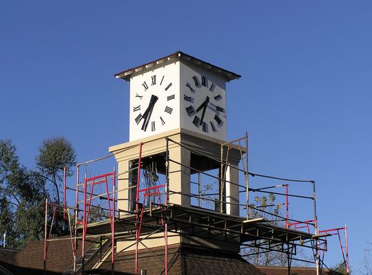 Time for More RF
You can see that this Sprint-Nextel co-location site is still under construction.  The cables are plainly visible inside the clock tower.  The hanging panel is for antenna grounding.  There are three GPS antennas on the roof of the building to the left of the clock tower (only one shown). The clock isn't running, but it's correct twice each day.  

