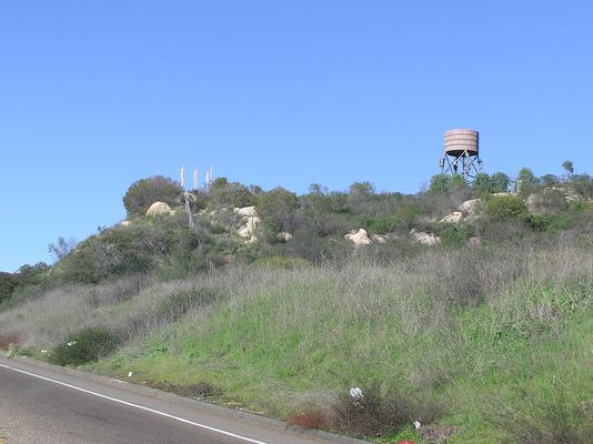 Faux Water Tank, plus...
Along the I15 just at the north end of Escondido you'll find this site. It contains a camo water tank, a second carrier below (on the legs), and ground-mounted antennas to the right of the tank.
Keywords: Water tank