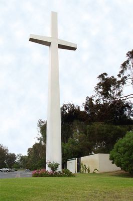 Sending out 'the word'
A cell site within a church cross.  The antennas are behind removable panels above the cross arm.  The equipment cabinets are behind the brick wall to the right in the picture.
Keywords: church cross irvine california