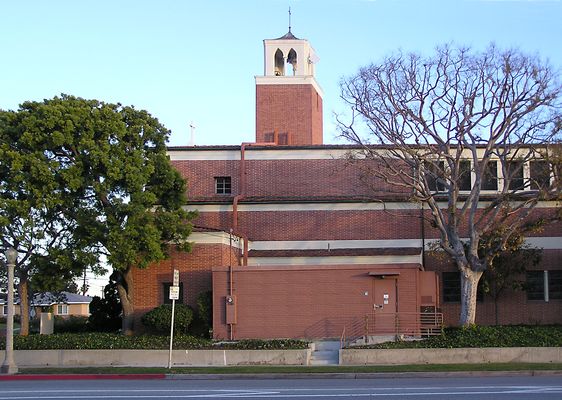 Sending out the word...to Los Angeles International Airport
This is an AT&T Wireless site just north of LAX.  It's a rather poor design Notice (1) the panels just above the roof line; the microwave panel antenna offset from the bell tower; and the cable runs down to the equipment building.  A good design element (perhaps the only one) is the use of the brick face on AT&T's pre-fab building. 
Keywords: AT&T Wireless LAX Church