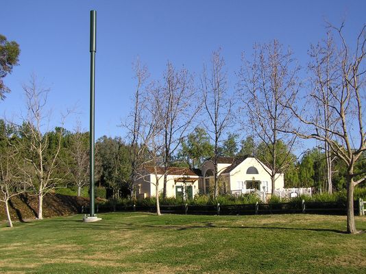 Mono-Park?
This Cingular monopole is located in a public park.  The BTS equipment is housed in the park building on the side closest to the monopole.  The GPS antenna is located on the side of the building with at 180 degrees of sky blocked by its location.
