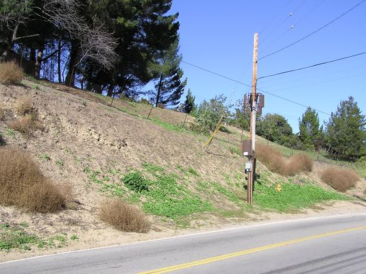 Two Sectors - One into a hillside!
As seen in the accompanying photo, the left-pointing antennas (sector) seem to provide excellent coverage for the hillside, and not much beyond it.  It would be interesting to know how much power this site and antennas produce, and whether any portion of the hillside is in an RF controlled zone.  The hillside, as you can see in the photo, is quite accessible to the general public.

