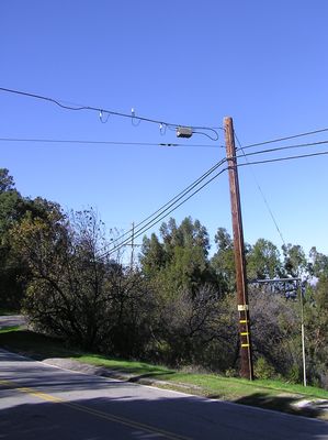 Sprint - Microcell using Sanders CATV radio
Sprint (especially in conjunction with Cox) deployed a significant number of the Sanders cable TV/cell interface.  This site uses very low gain antennas (the two outside antennas are for reception from the users, and the center antenna is for transmission to the users).  Sprint has built its own CATV-like wireless system to connect many of its sites back to its MTSOs.  
