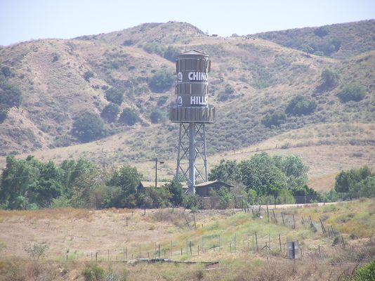 It's a Barrel...It's a Tank...It's...well....a Multicarrier site
This interesting multicarrier site has the antennas on the outside of the tank structure.  Chino Hills, California.  Note, the cattle at the top of the hill are real.
Keywords: chino hills california water tank