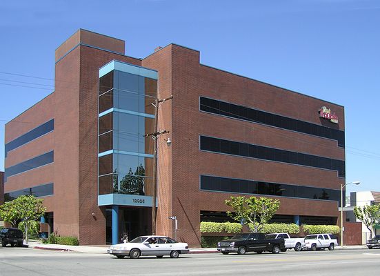 No Trouble Here! (1 of 3)
This Nextel site in North Hollywood, California has its equipment room located to the right of the building in the brick-faced 1 story extension.  The antennas are mounted behind RF transparent panels finished to look like a brick parapet (top left).
Keywords: nextel faux parapet brick