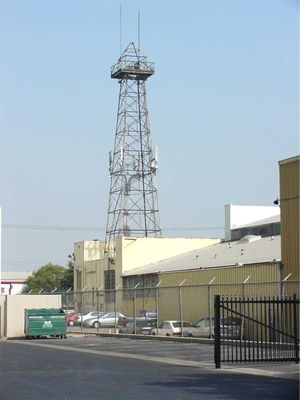 Oil's Well that Emits Well
Old oil wells can make good cell sites, even when a building has been built around the base!
Keywords: oil well