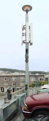 Parking lot cell site
The cell antennas are mounted on the light standard on the roof of a public parking lot in San Francisco.
Keywords: parking lot cell site