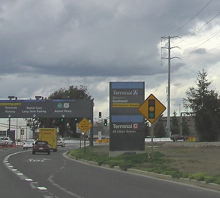Flush Mount Cell Site on PG&E Transmission Pole - San Jose, CA Airport
The interesting point about the cell antennas mounted to PG&E's transmission pole (seen in the right side of the photo) is that the antennas are not out on arms.  Usually power companies require carriers to mount antennas on arms to insure adequate climbing space under NESC/CPUC GO95.
Keywords: PGE power transmission tower san jose airport flush nesc go95 cpuc