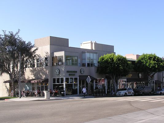 A "Sort-a-flaged" Site
Learning the techniques...and the results...of planning wireless sites can be demonstrated by this site.  This result serves as a sound basis to continue to upgrade the camouflage techniques that are applied to projects of this type. Optimally, Sprint's BTS cabinet would not be visible, and the RF transparent panels would be incorporated into a rooftop treatment that doesn't call attention to itself.  Thanks to Larry Thomas for identifying this as a Sprint site.
Keywords: santa monica 15th montana sprint