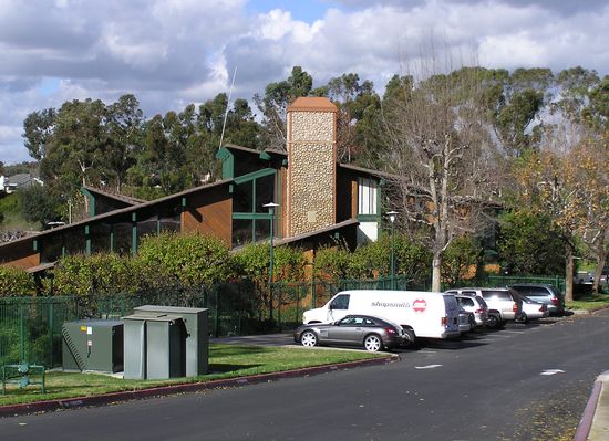 Sun, Sail, and Signal #2
This camo chimney is located at the Sun and Sail Club in Lake Forest, California.  The AT&T Wireless and Cingular antennas are behind the faux rock detail at the top of the chimney.  The BTS equipment is located directly below, and in front of the chimney (out of sight in this photo, just below the wood box containing the coaxial and ground cables).
Keywords: attws cingular faux chimney rock