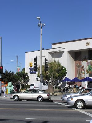 Updated to Digital...
This overview shot shows the antennas (cells and GPS) on a traffic signal, and the BTS equipment in the sidewalk area to the left of the traffic signal.  Compare this photo to the photograph in this gallery from a few years ago when this was an analog site.
