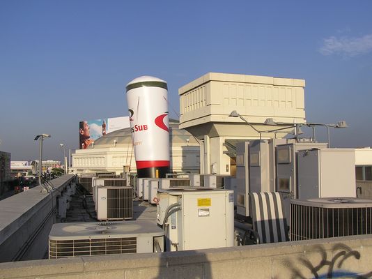 Sprint Camo Elevator Penthouse Site
In West Los Angeles, Sprint's antennas are located in a faux elevator penthouse, and the base telecommunications station equipment is in the foreground on the left side.  If you look closely on the top of the parapet you'll see a pair of AT&T Wireless (now Cingular) omnidirectional antennas.  Those antennas are featured elsewhere in this gallery.
Keywords: Sprint camo elevator faux penthouse AT&T cingular omnidirectional antennas