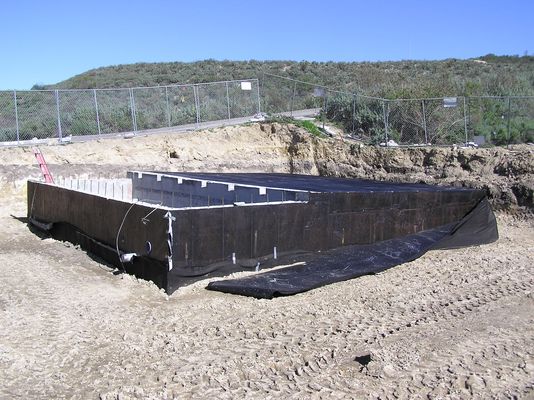 About 75 percent of the building is buried
The backfill is covering the building up to about the 75% level.  Soon it will be completely buried, and the transmitter and related equipment will be moved in.
Keywords: KMLT