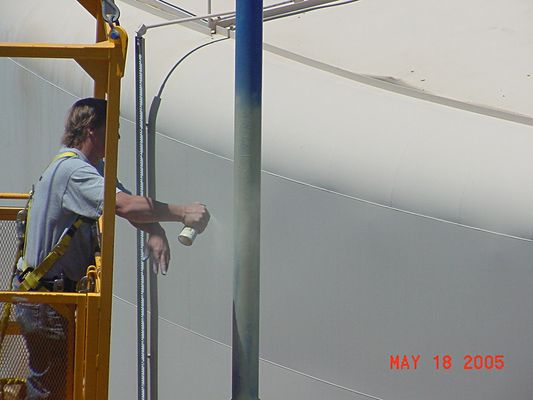 Painting on the Sky 6 of 6
A close up of Bill priming the next section of the pole, and...from the looks of it...part of his left hand.
Keywords: painting on the sky kmlt