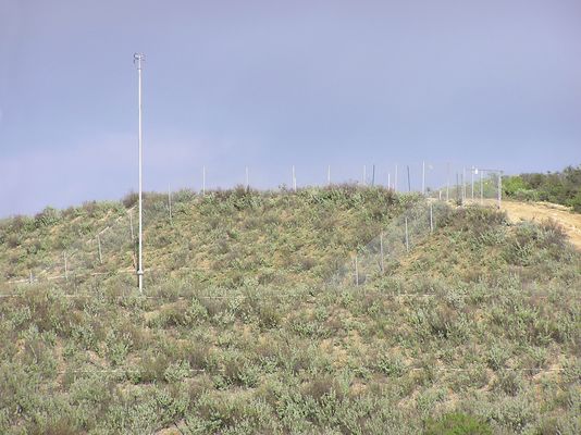 KMLT's Antenna Fence Under Construction
The fence being constructed is to keep the hikers in the area away from the antenna site.  At the time this photo was snapped KMLT was operating from its old (aux) transmitter site some miles away.
Keywords: kmlt antenna fence